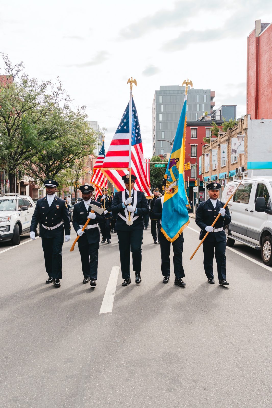 The honor guard marching with flags