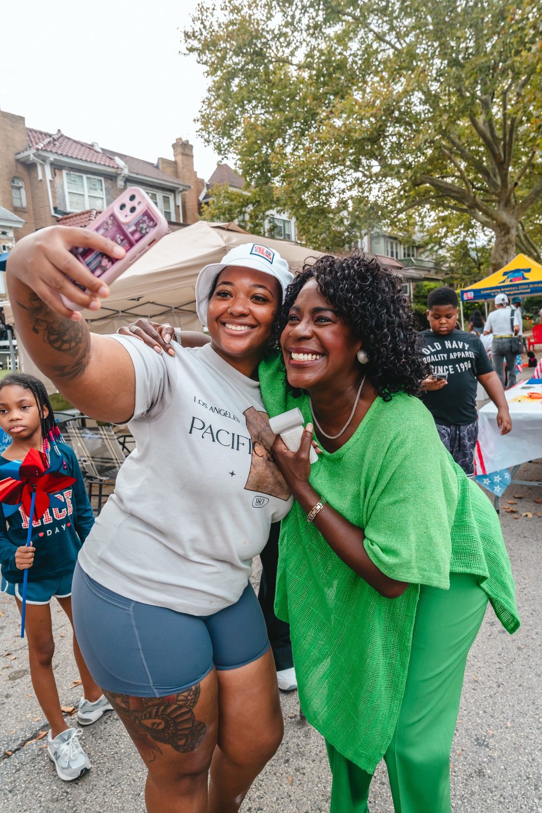A resident takes a selfie with Mayor Cherelle L. Parker