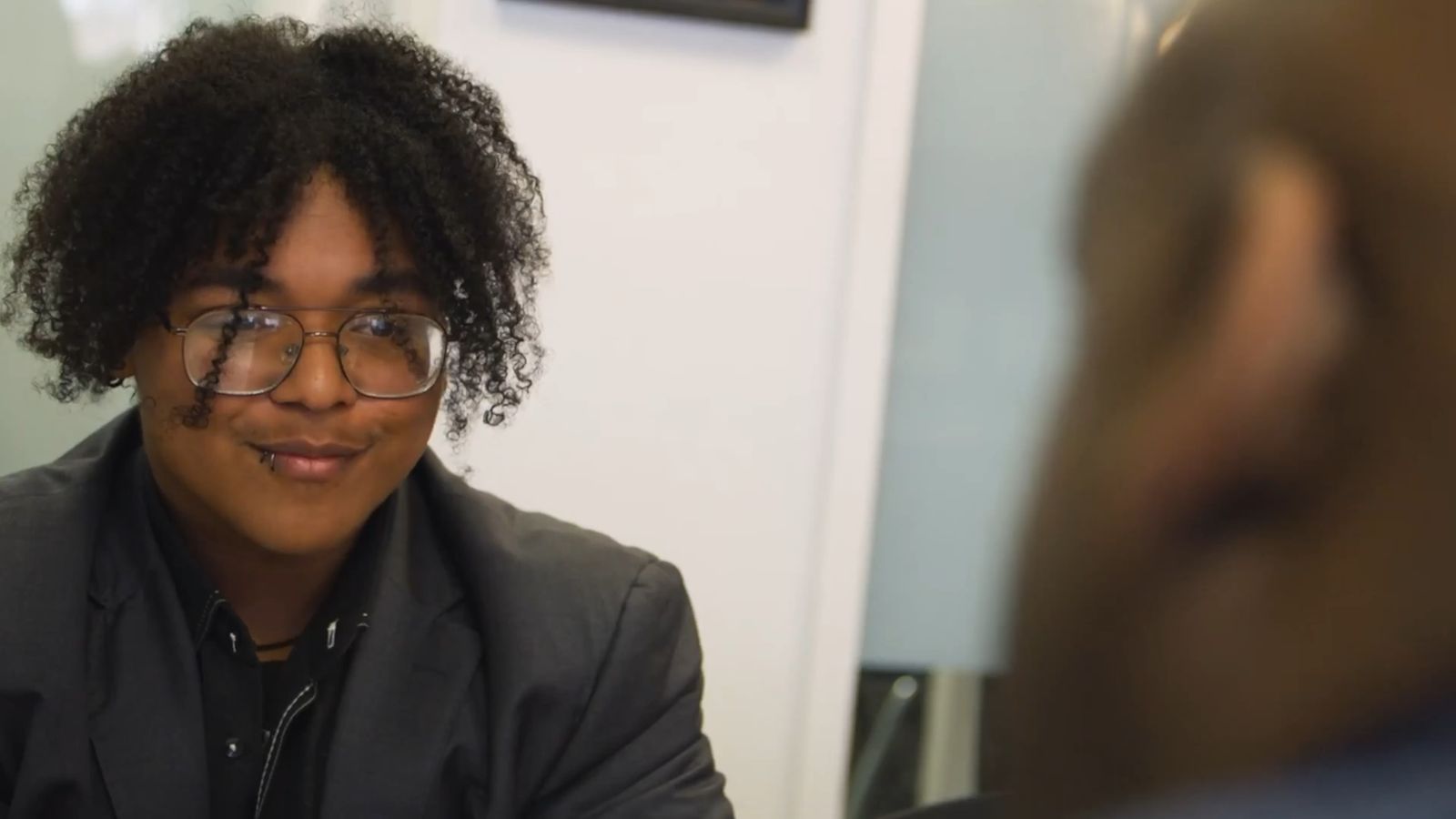 A YouthBuild student smiling during an interview